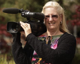 screenwriter candace egan with camera portrait photo for the wiki screenplay contest